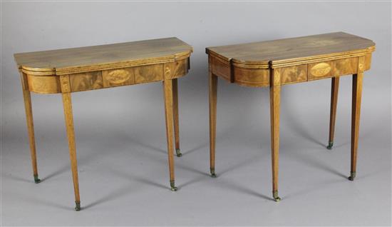 A pair of George III style mahogany D shaped tea tables, W.2ft 10in. D.1ft 4in. H.2ft 5in.